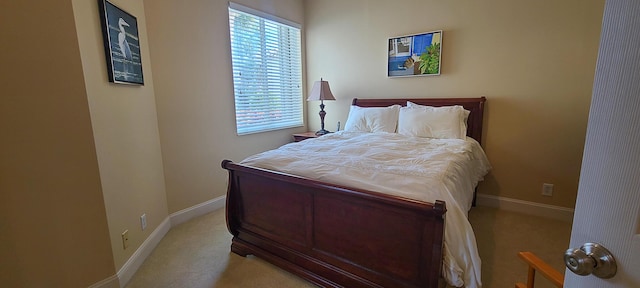 bedroom with light colored carpet