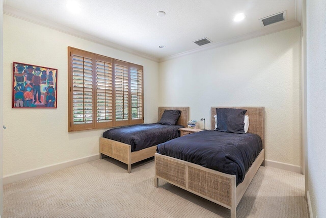 bedroom featuring ornamental molding and light colored carpet