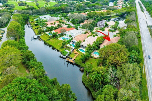 bird's eye view with a water view