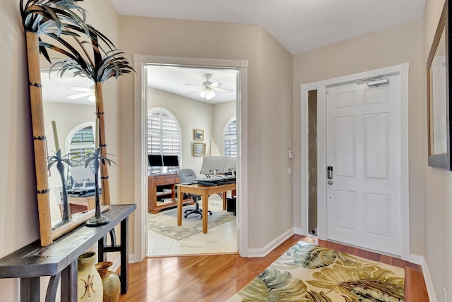 foyer entrance featuring ceiling fan and hardwood / wood-style floors