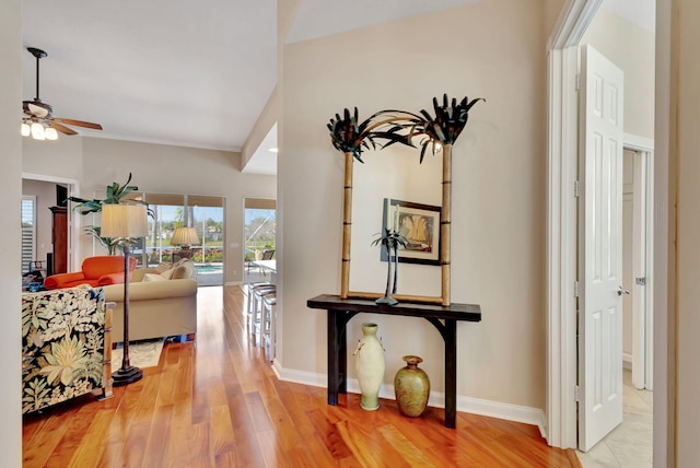 corridor with hardwood / wood-style floors