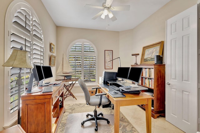 office with ceiling fan and light tile patterned floors