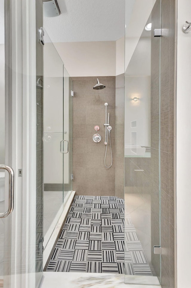 bathroom featuring an enclosed shower