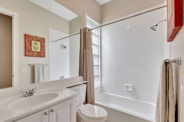 full bathroom featuring vanity, shower / tub combo, and toilet