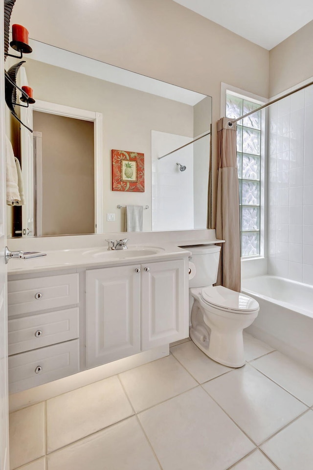 bathroom featuring toilet, vanity, shower / bath combination with curtain, and tile patterned floors