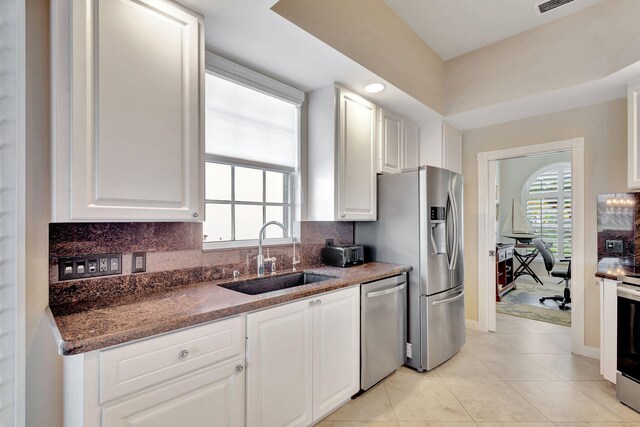 full bathroom with vanity, tile patterned floors, plus walk in shower, and toilet