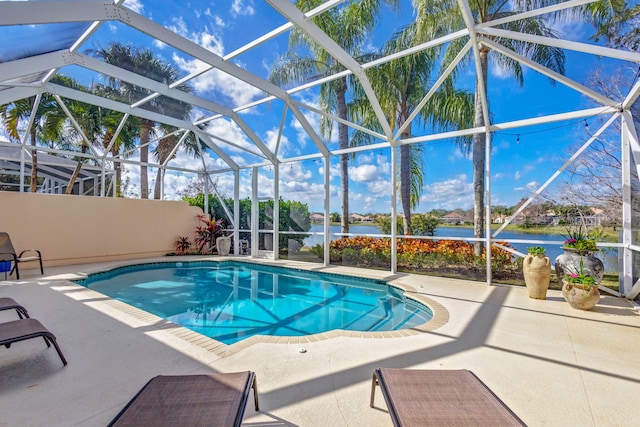 view of swimming pool featuring a water view, a lanai, and a patio