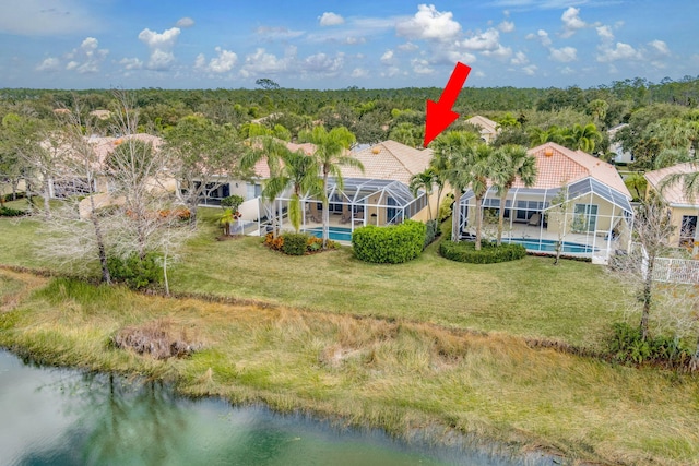 bird's eye view featuring a water view and a view of trees