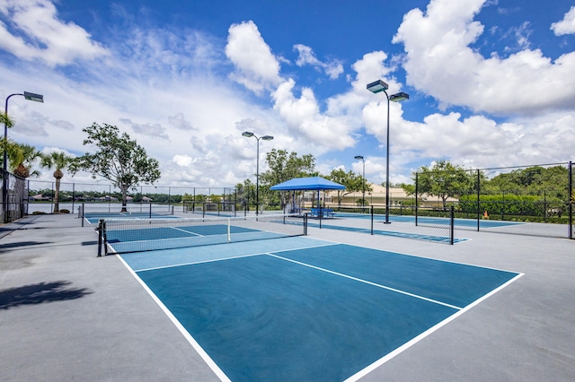 view of tennis court with fence