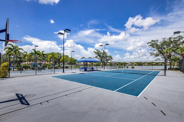 view of tennis court with fence