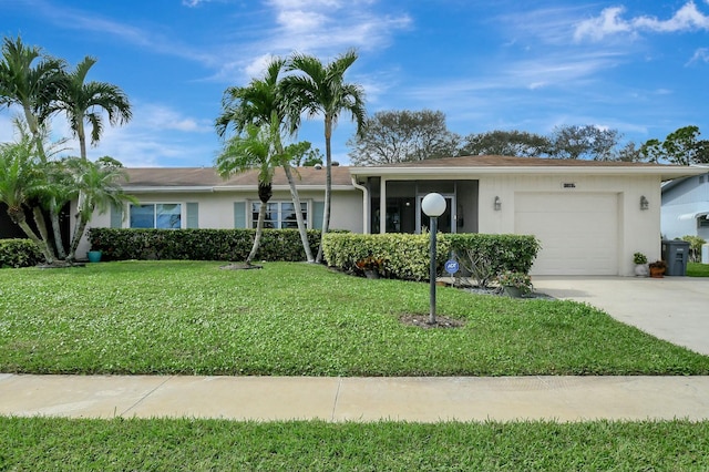 ranch-style house featuring a garage and a front lawn