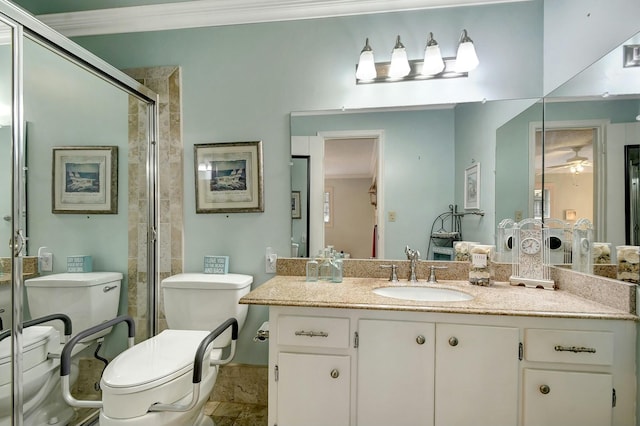 bathroom featuring a shower with shower door, vanity, toilet, and crown molding