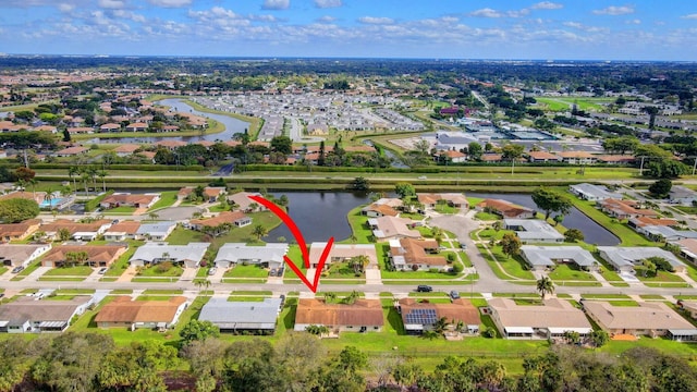 bird's eye view featuring a residential view and a water view