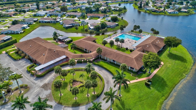 birds eye view of property with a residential view and a water view