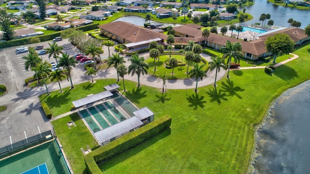 birds eye view of property with a residential view and a water view