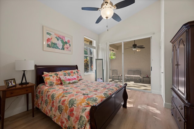 bedroom featuring lofted ceiling, ceiling fan, and light hardwood / wood-style flooring