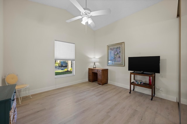 miscellaneous room featuring vaulted ceiling, ceiling fan, and light wood-type flooring