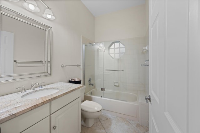 full bathroom featuring toilet, vanity, shower / bath combination with glass door, and tile patterned flooring