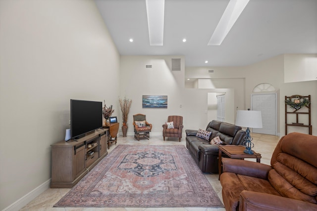 living room featuring a skylight