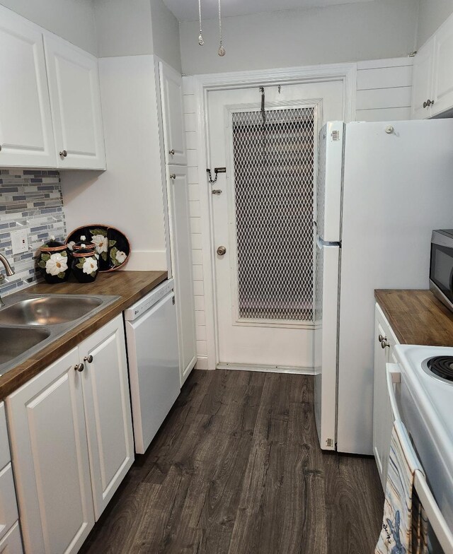 kitchen with sink, tasteful backsplash, wooden counters, white dishwasher, and white cabinets