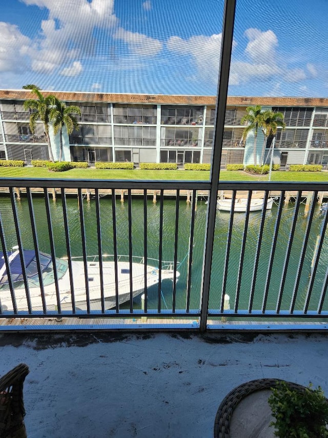 balcony featuring a water view