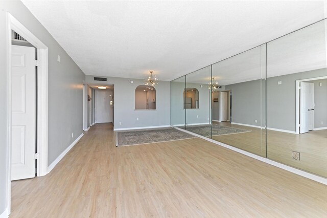 bathroom featuring tile patterned flooring, tile walls, vanity, a textured ceiling, and toilet