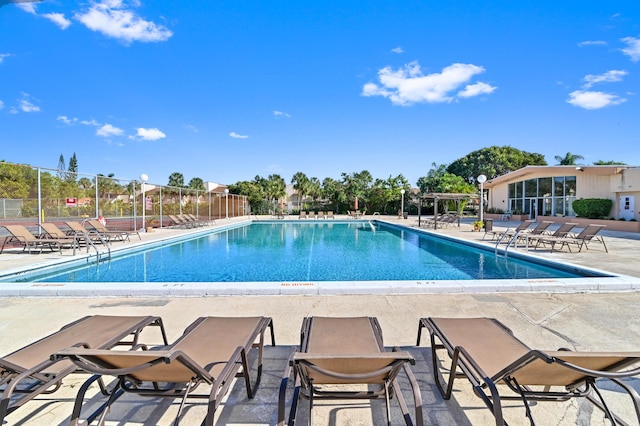 view of swimming pool featuring a patio area