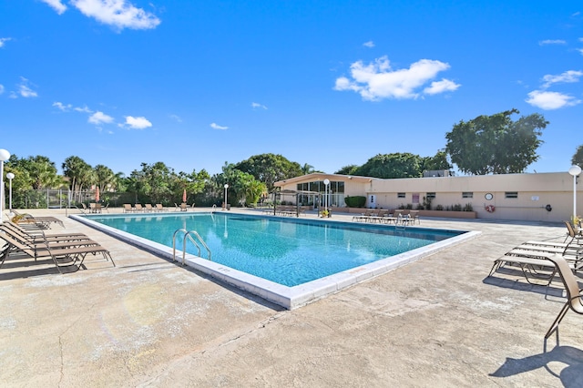 view of swimming pool with a patio area