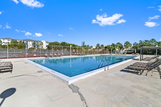 view of swimming pool with a patio