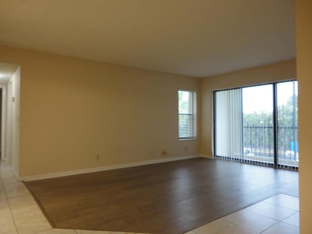 unfurnished room featuring light tile patterned floors