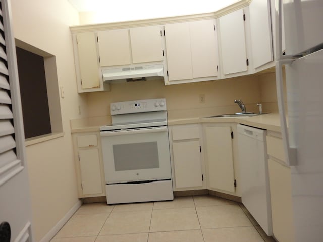 kitchen with white cabinetry, sink, white appliances, and light tile patterned flooring