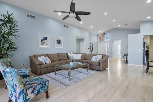 living room featuring ceiling fan, high vaulted ceiling, and light hardwood / wood-style floors