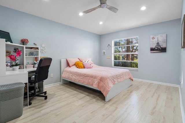 bedroom with light hardwood / wood-style flooring and ceiling fan