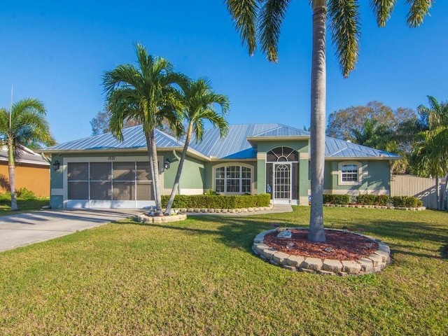 single story home with a garage and a front lawn