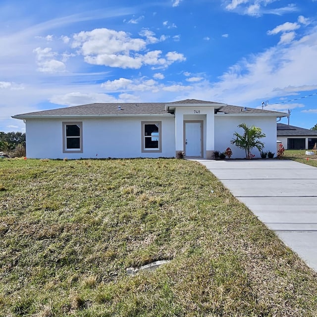 ranch-style home with a front yard