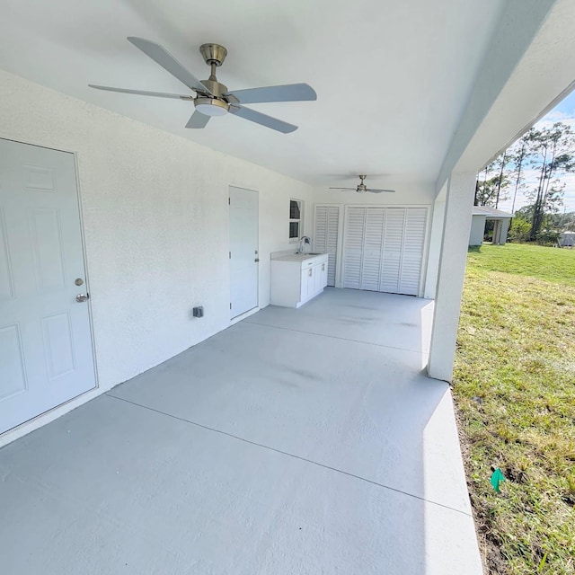 view of patio / terrace featuring sink and ceiling fan