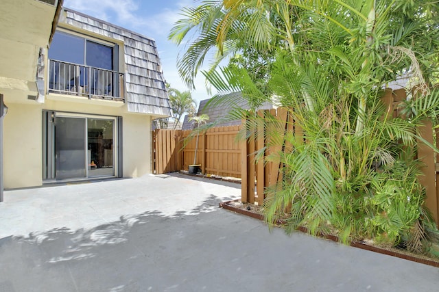 view of patio featuring fence