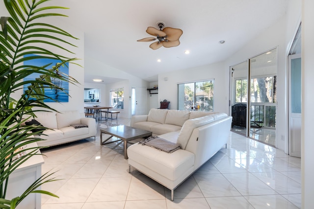 tiled living room featuring high vaulted ceiling and ceiling fan