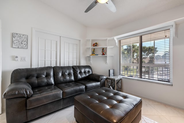 living room featuring light tile patterned floors, vaulted ceiling, and ceiling fan