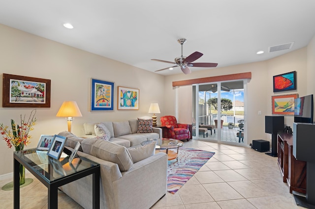 living area featuring light tile patterned floors, visible vents, baseboards, ceiling fan, and recessed lighting