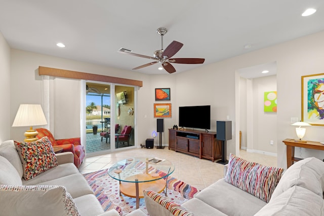 living area with light tile patterned floors, ceiling fan, baseboards, and recessed lighting