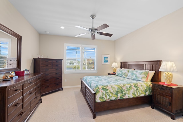 bedroom with a ceiling fan, recessed lighting, light colored carpet, and baseboards