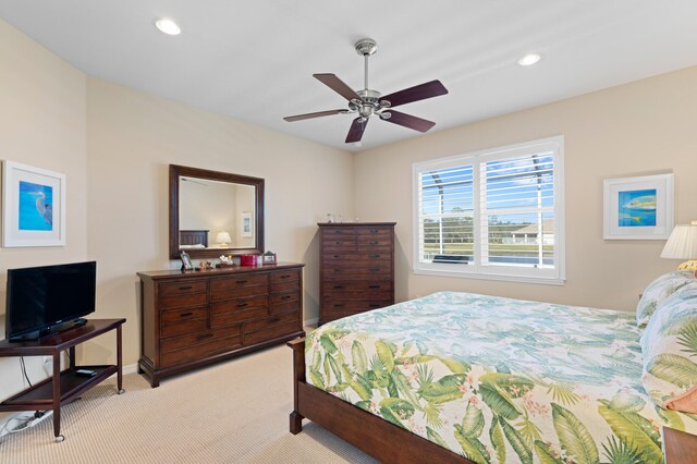 carpeted bedroom featuring ceiling fan