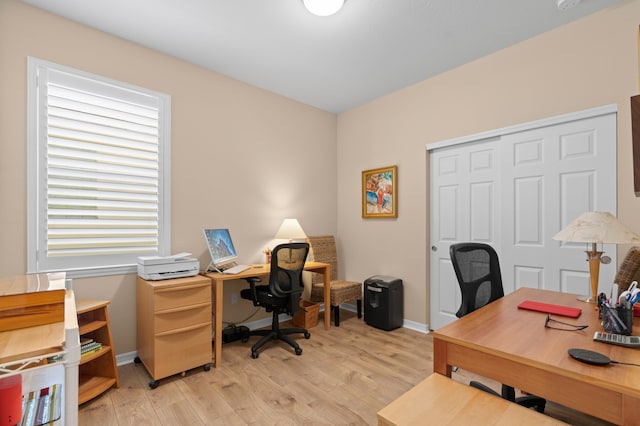 home office featuring light wood-style flooring and baseboards