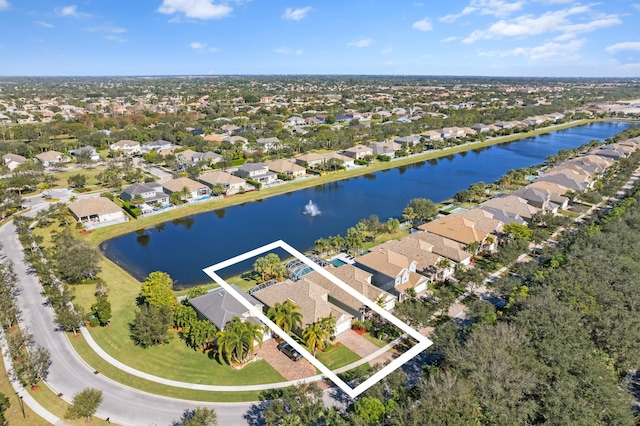 bird's eye view featuring a water view and a residential view