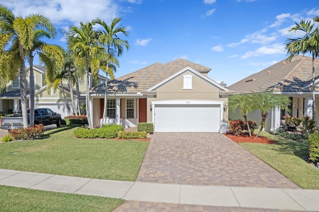 view of front of property with a garage and a front yard