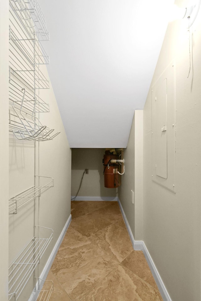 walk in closet featuring vaulted ceiling and electric panel