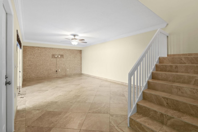 interior space with ornamental molding and ceiling fan