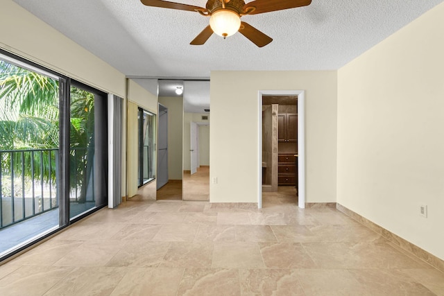 unfurnished room with a textured ceiling