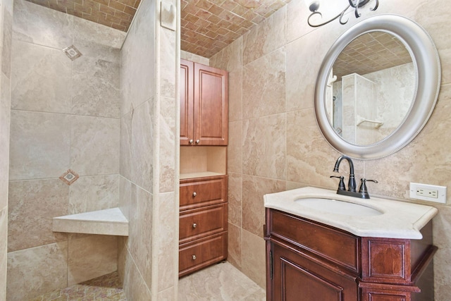 bathroom with brick ceiling, tile walls, and vanity